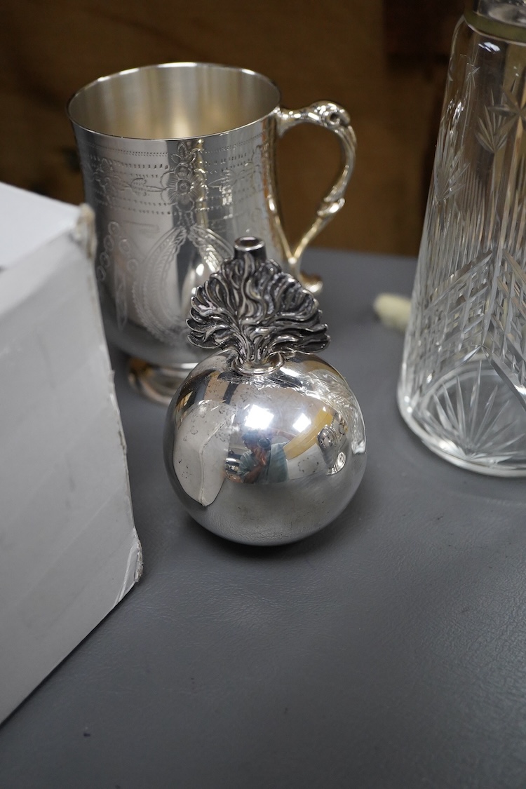 A silver plated etched cup, silver plated cup, a silver plated candlestick, two silver napkin rings, a cut glass sugar shaker and a silver paperweight & eight other items.
